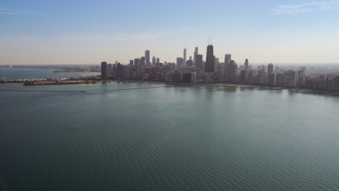 AX0002_018.0000304F - Aerial stock photo of The Downtown Chicago skyline, seen from Lake Michigan, Illinois