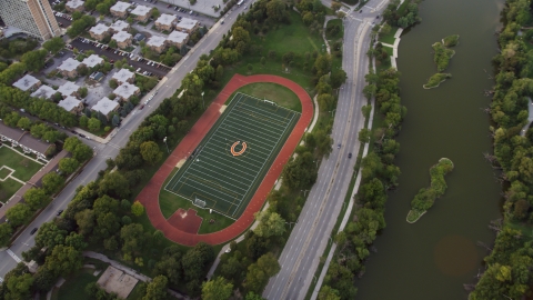AX0003_018.0000049F - Aerial stock photo of A hockey field in Jackson Park at twilight, Chicago, Illinois