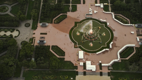 AX0003_082.0000071F - Aerial stock photo of Buckingham Fountain in Grant Park, at twilight, Downtown Chicago, Illinois