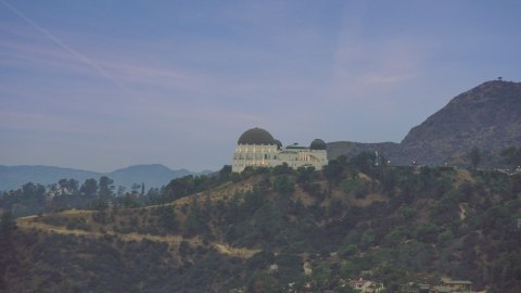 AX0158_007.0000416 - Aerial stock photo of Griffith Observatory at twilight in Los Angeles, California