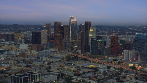 AX0158_044.0000179 - Aerial stock photo of Downtown Los Angeles skyline with new skyscraper, Wilshire Grand Center, twilight, California