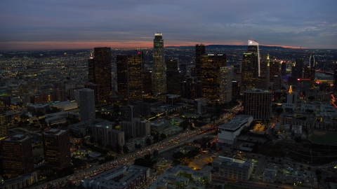 AX0158_051.0000214 - Aerial stock photo of Tall skyscrapers at twilight in Downtown Los Angeles, California