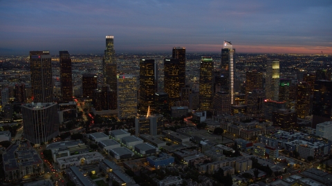 AX0158_052.0000310 - Aerial stock photo of A view of skyscrapers at twilight in Downtown Los Angeles, California
