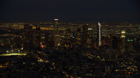 AX0158_073.0000309 - Aerial stock photo of The Downtown Los Angeles skyline at night, California