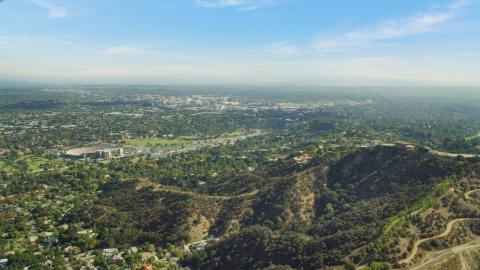 AX0159_092.0000006 - Aerial stock photo of Residential neighborhoods seen from a hilltop, Pasadena, California