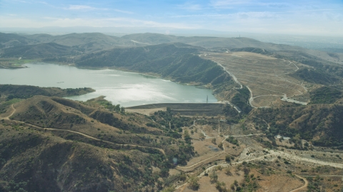 AX0159_160.0000213 - Aerial stock photo of Irvine Lake and Santiago Dam, Orange, California