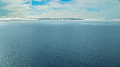 AX0159_240.0000319 - Aerial stock photo of Santa Catalina Island seen from across the ocean, California
