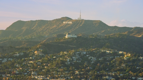 AX0162_045.0000068 - Aerial stock photo of The Hollywood Sign behind Griffith Observatory in Los Angeles, California