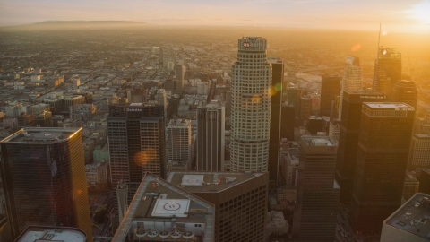 AX0162_082.0000322 - Aerial stock photo of US Bank Tower and skyscrapers at sunset in Downtown Los Angeles, California