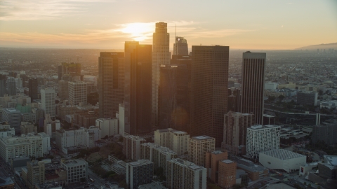 AX0162_088.0000000 - Aerial stock photo of Tall city skyscrapers of downtown at sunset in Downtown Los Angeles, California