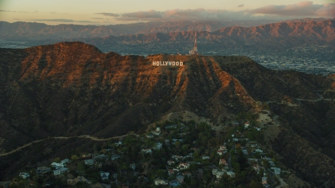 AX0162_101.0000000 - Aerial stock photo of The Hollywood Sign at twilight in Los Angeles, California