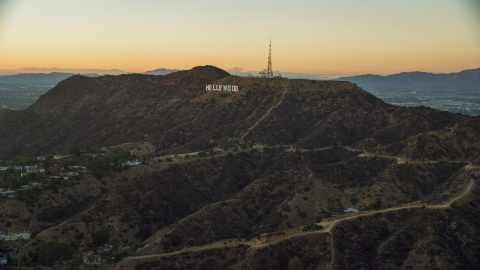AX0162_107.0000000 - Aerial stock photo of The world famous Hollywood Sign at twilight in Los Angeles, California