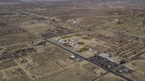 AX06_101.0000199 - Aerial stock photo of Neighborhoods in a desert town in Rosamond, California