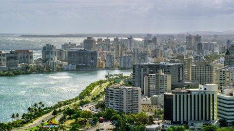 AX101_003.0000000F - Aerial stock photo of Waterfront Apartment Buildings in the rain, San Juan Puerto Rico