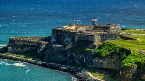 AX101_016.0000189F - Aerial stock photo of Fort San Felipe del Morro, a Caribbean fort, in Old San Juan, Puerto Rico