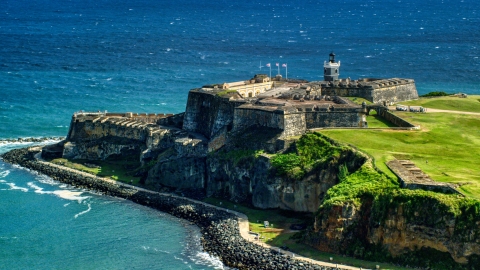 AX101_017.0000000F - Aerial stock photo of Historic fort overlooking the blue waters of the Caribbean, Old San Juan, Puerto Rico