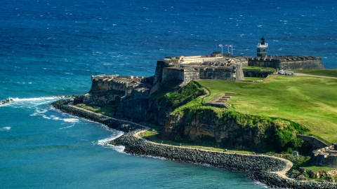 AX101_018.0000000F - Aerial stock photo of Historic fort on the coast by the blue waters of the Caribbean, Old San Juan, Puerto Rico