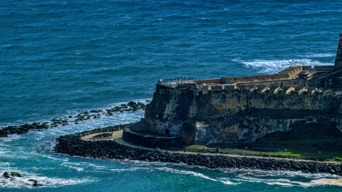 AX101_021.0000000F - Aerial stock photo of Tourists visiting the Castillo San Felipe del Morro in Old San Juan, Puerto Rico