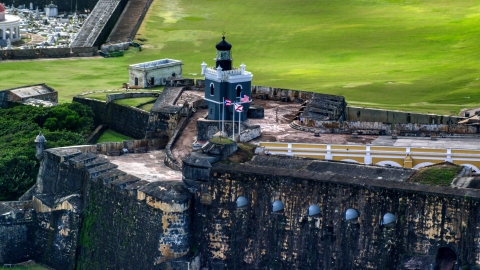 AX101_023.0000000F - Aerial stock photo of Castillo San Felipe del Morro lighthouse, Old San Juan, Puerto Rico