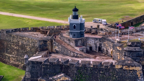 AX101_024.0000203F - Aerial stock photo of Historic fort and lighthouse, Old San Juan Puerto Rico