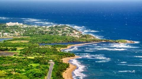 AX101_031.0000000F - Aerial stock photo of Resort town by the beach and blue Caribbean coastal waters, Dorado, Puerto Rico