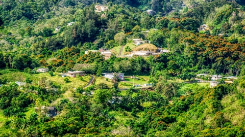 AX101_041.0000000F - Aerial stock photo of Rural homes in the tree covered hills, Vega Baja, Puerto Rico 