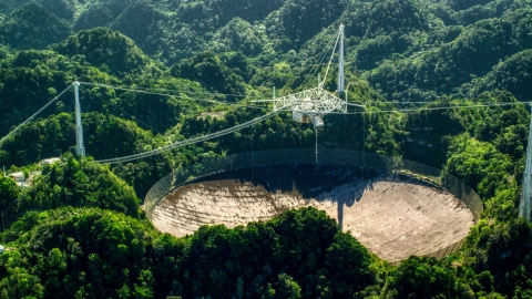 AX101_095.0000000F - Aerial stock photo of Arecibo Observatory dish and Karst forest, Puerto Rico
