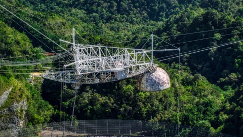AX101_112.0000000F - Aerial stock photo of The top structure of the Arecibo Observatory in Puerto Rico 