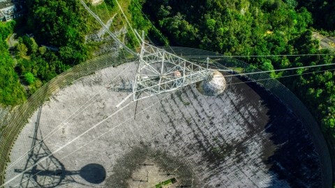 AX101_119.0000000F - Aerial stock photo of Bird's eye view of the Arecibo Observatory, Puerto Rico 