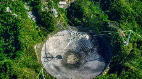 AX101_121.0000000F - Aerial stock photo of A bird's eye of the Arecibo Observatory in Puerto Rico