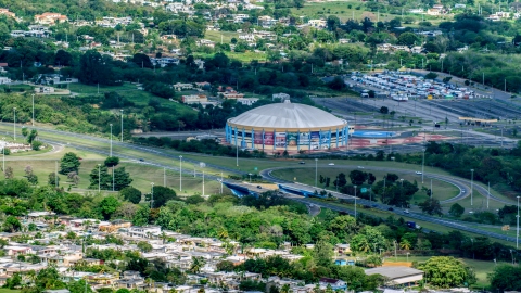 AX101_133.0000000F - Aerial stock photo of Coliseo Manuel Iguina sporting arena, Arecibo Puerto Rico