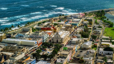 AX101_138.0000000F - Aerial stock photo of Coastal buildings and Catedral San Felipe, Arecibo Puerto Rico