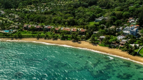 AX101_213.0000288F - Aerial stock photo of Beachfront homes by the water on a Caribbean island, Dorado, Puerto Rico