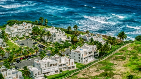 AX101_219.0000256F - Aerial stock photo of Condominiums on the Caribbean island coast in Dorado, Puerto Rico 