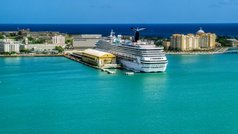AX101_237.0000257F - Aerial stock photo of Cruise ship anchored at the Port of San Juan, Puerto Rico 