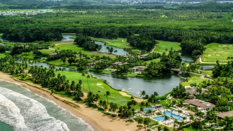 AX102_040.0000127F - Aerial stock photo of Caribbean beachfront resort in Rio Grande, Puerto Rico 