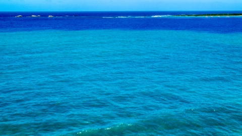AX102_071.0000275F - Aerial stock photo of Tiny islands across blue Caribbean ocean in Fajardo, Puerto Rico 