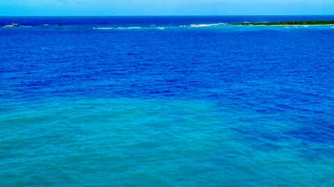AX102_072.0000181F - Aerial stock photo of Crystal clear blue Caribbean waters and tiny islands, Rada Fajardo, Puerto Rico 