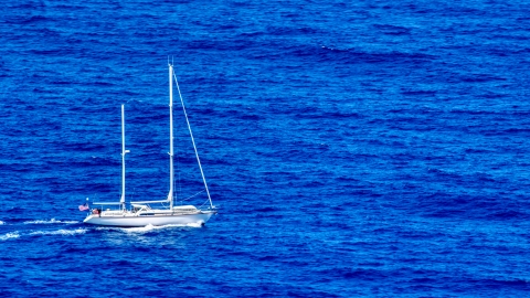 AX102_106.0000000F - Aerial stock photo of Sail boat in sapphire blue waters, Culebra, Puerto Rico 
