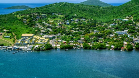 AX102_144.0000000F - Aerial stock photo of Factory and waterfront property in a small town, Culebra, Puerto Rico 