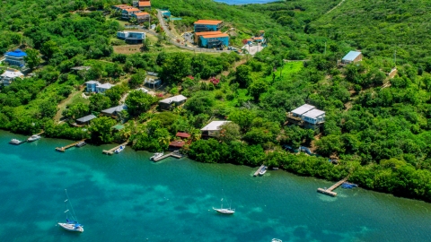 AX102_156.0000164F - Aerial stock photo of Caribbean homes with docks on the island of Culebra, Puerto Rico
