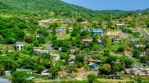 AX102_165.0000000F - Aerial stock photo of Residential neighborhoods on a hillside, Culebra, Puerto Rico 