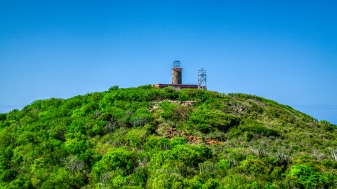 AX102_177.0000274F - Aerial stock photo of The hilltop Culebrita Lighthouse in Puerto Rico 