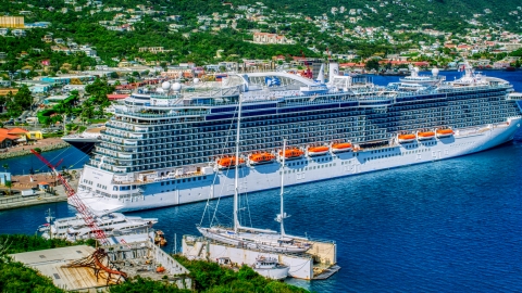 AX102_202.0000435F - Aerial stock photo of Cruise ship docked in Charlotte Amalie, St. Thomas, US Virgin Islands