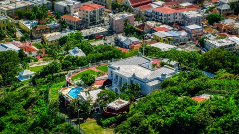 AX102_217.0000076F - Aerial stock photo of The Governor's Mansion in Charlotte Amalie, St Thomas, US Virgin Islands 
