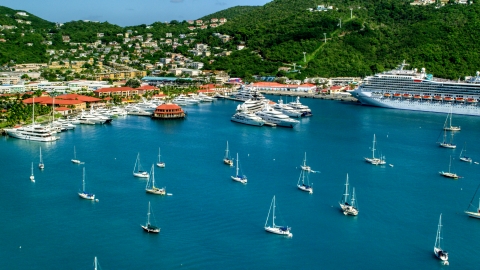 AX102_230.0000193F - Aerial stock photo of Sailboats, yachts, and a cruise ship in sapphire blue waters of the harbor, Charlotte Amalie, St Thomas
