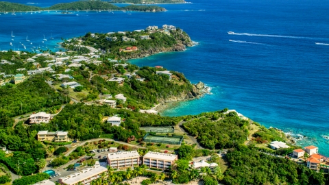 AX102_246.0000000F - Aerial stock photo of Upscale oceanfront homes beside sapphire blue waters, East End, St Thomas 