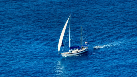 AX102_255.0000094F - Aerial stock photo of Sailboat in sapphire blue waters, St Thomas, USVI 