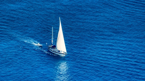 AX102_256.0000138F - Aerial stock photo of Sailboat in sapphire blue Caribbean waters, St Thomas, USVI 