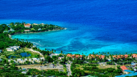 AX102_257.0000099F - Aerial stock photo of Condominium resort beside sapphire blue Caribbean waters, East End, St Thomas